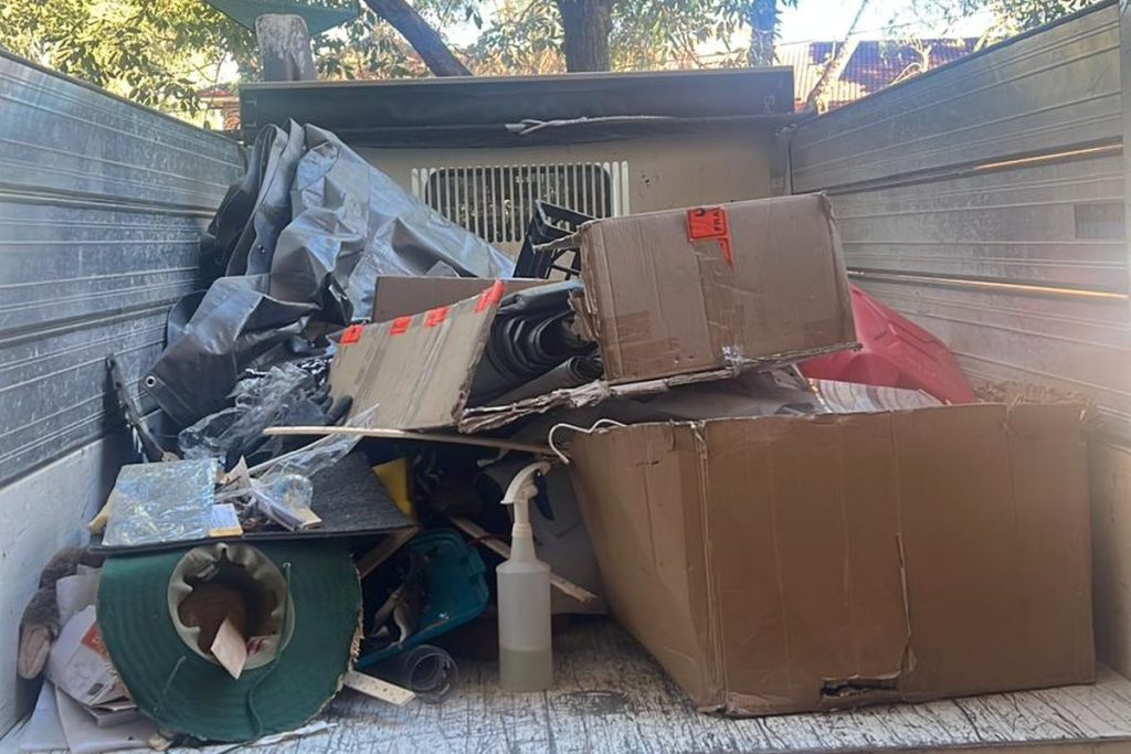 Rubbish Runners truck loaded with boxes and household rubbish